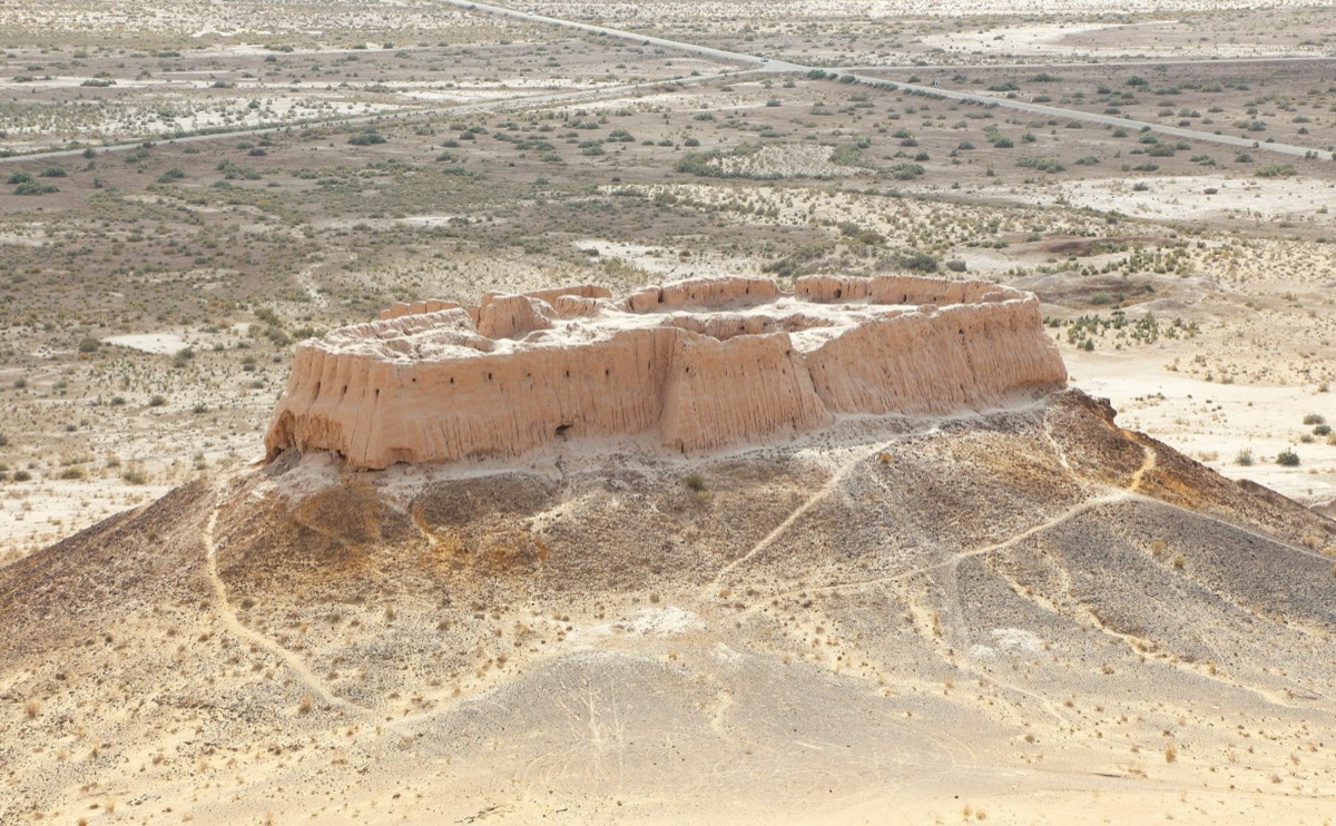 Aerial view of the Ayaz-Kala fortress ruins on a desert hilltop in Khorezm, Uzbekistan